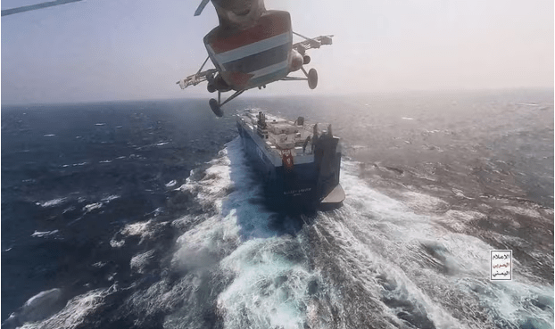 In November 2023, a Houthi military helicopter was captured hovering above the Red Sea's Galaxy Leader cargo ship. Image courtesy: Houthi Military Media/Reuters